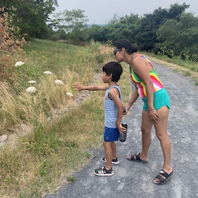 Community Members Studying Flowers_Spectacle